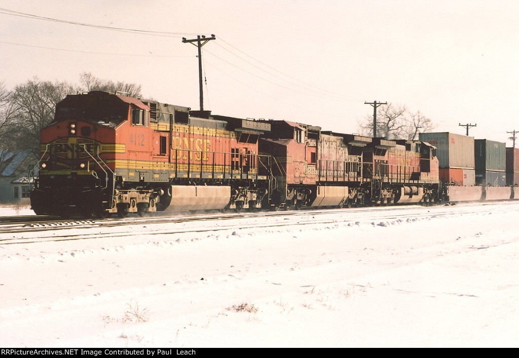 Stack train rolls west through University